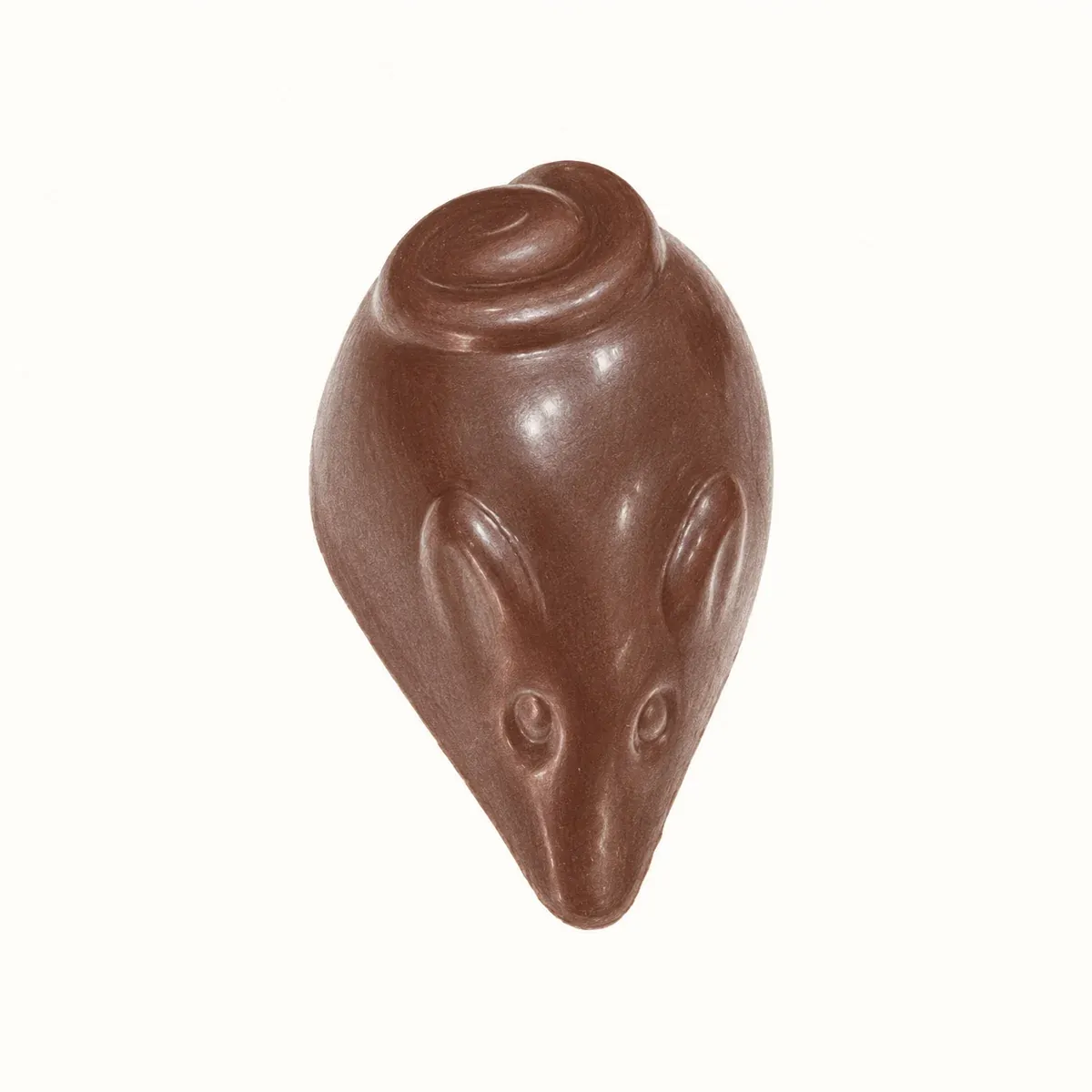 Praline artisanale en forme de souris, en chocolat au lait, garnie d’un praliné noisette intense.